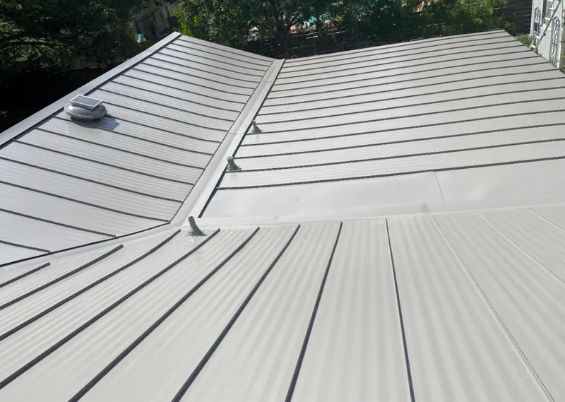 Solar attic fan installed on a metal roof for Roof Ventilation in West Plains